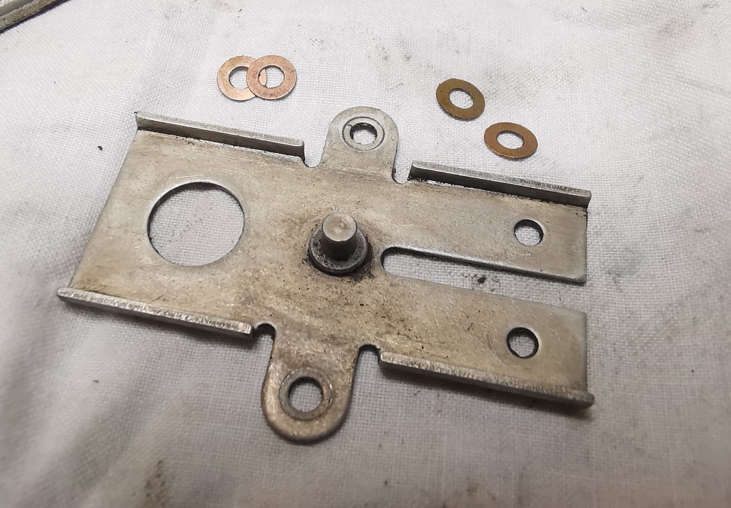 2x shims found under each slider guide plate tab.jpg